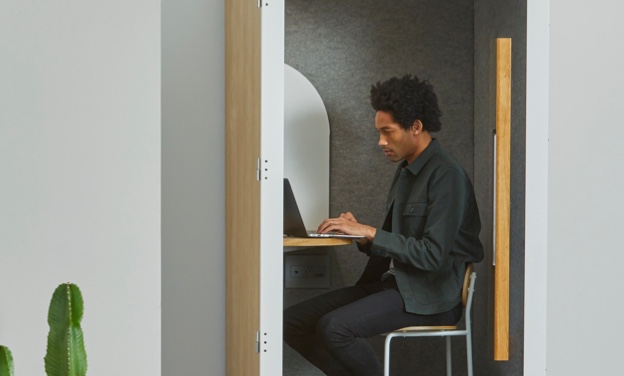 resume and interview coach Man working on computer in cubicle